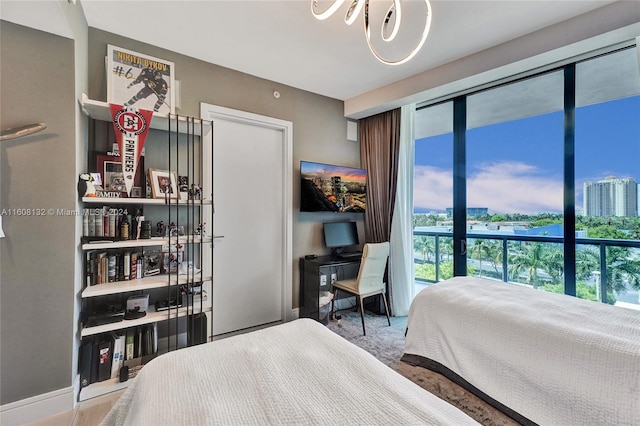 bedroom with a notable chandelier