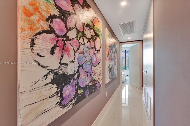 corridor with light tile patterned flooring