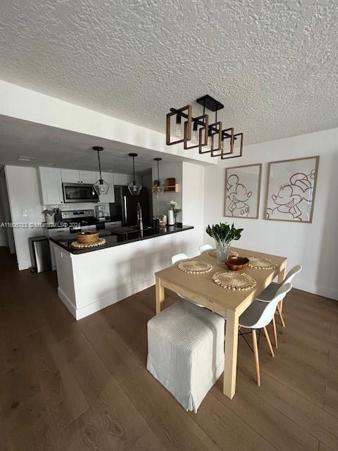 dining area featuring dark hardwood / wood-style floors