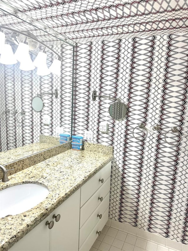 bathroom featuring tile flooring and oversized vanity