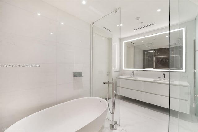 bathroom with tile floors, large vanity, and plus walk in shower