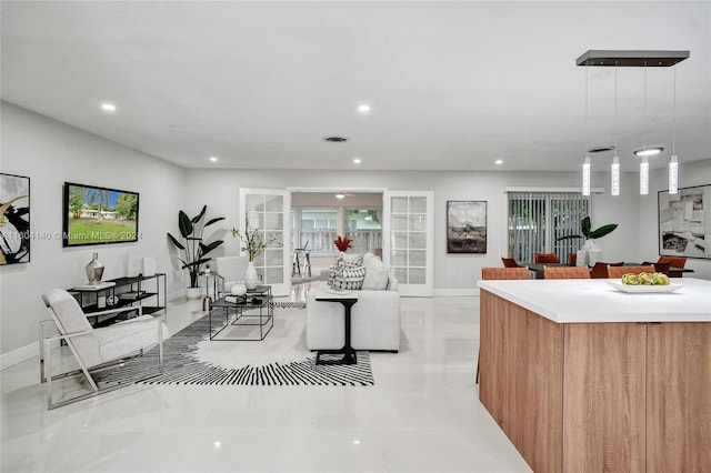 tiled living room featuring french doors