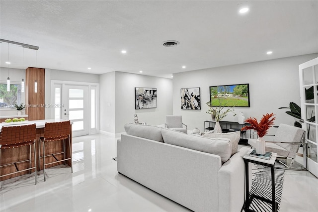 living room featuring a textured ceiling