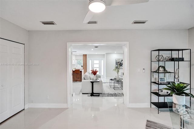 hallway with light tile patterned floors