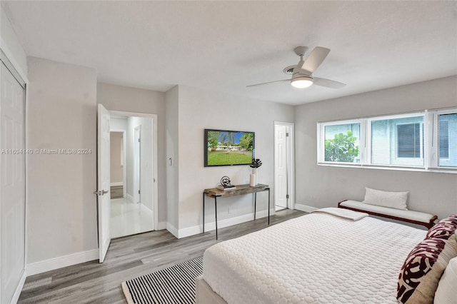 bedroom featuring hardwood / wood-style floors and ceiling fan