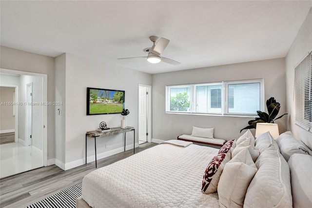 bedroom featuring ceiling fan and light wood-type flooring