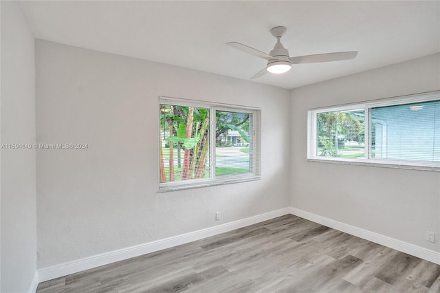 unfurnished room featuring ceiling fan and light hardwood / wood-style flooring