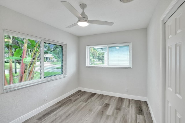 unfurnished room featuring ceiling fan and light wood-type flooring