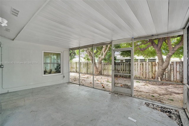 unfurnished sunroom with wood ceiling