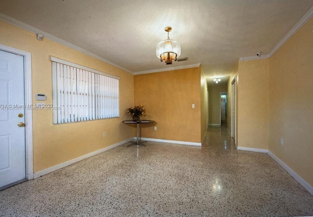 unfurnished room with a notable chandelier and ornamental molding