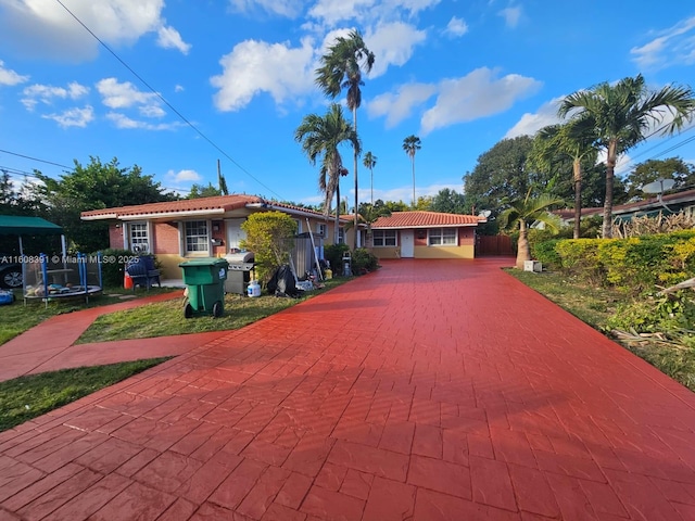 view of front of property featuring a trampoline