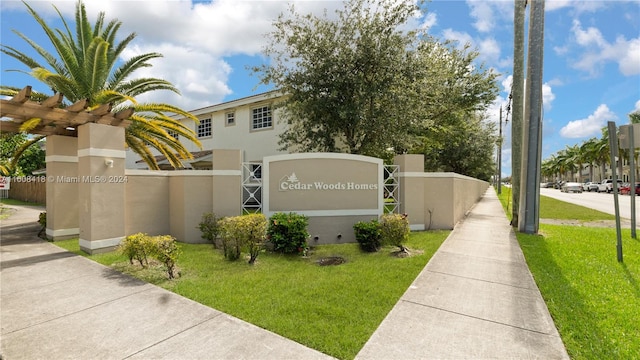 view of front of home featuring a garage and a balcony