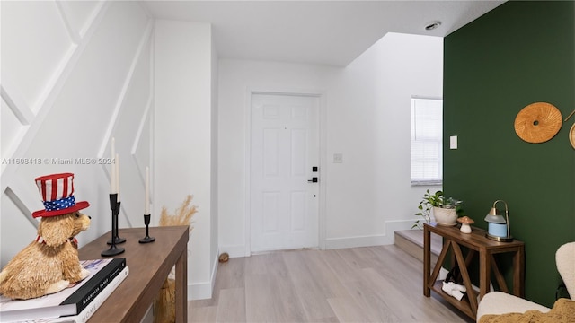 entryway with wood-type flooring