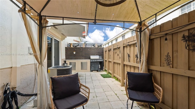 view of patio featuring cooling unit