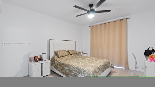 bedroom featuring ceiling fan and light wood-type flooring