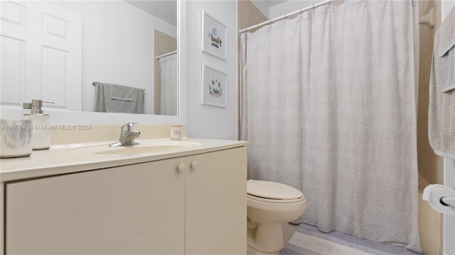 bathroom with toilet and vanity