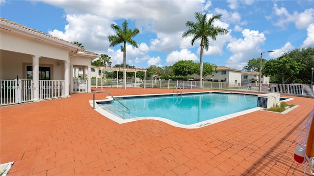 view of swimming pool with a patio