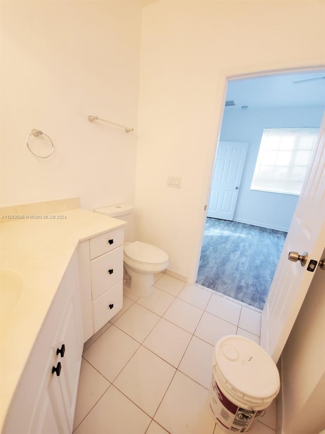 bathroom with tile patterned flooring and toilet