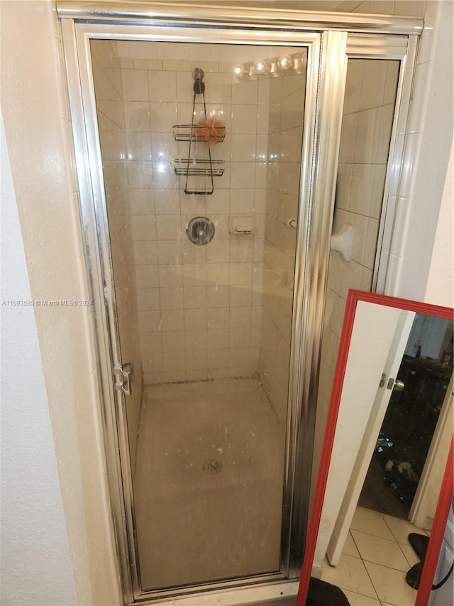 bathroom featuring tile patterned floors and walk in shower