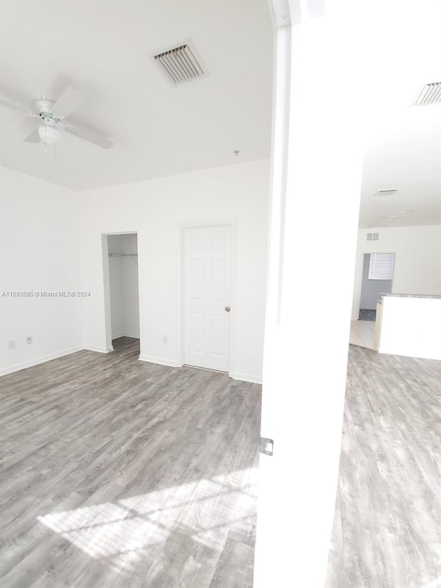 unfurnished room with ceiling fan and light hardwood / wood-style flooring