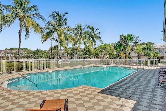 view of swimming pool with a patio