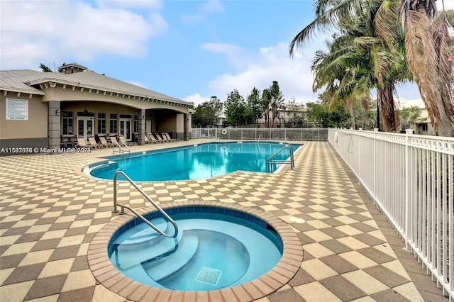 view of pool with a community hot tub and a patio