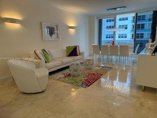 living room featuring ornamental molding and floor to ceiling windows