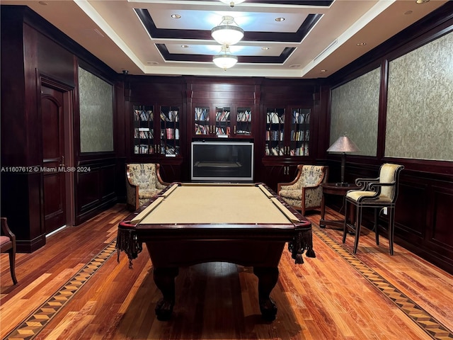 rec room with hardwood / wood-style flooring, pool table, and a raised ceiling