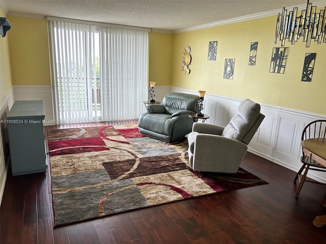 living room featuring a textured ceiling, ornamental molding, and dark hardwood / wood-style flooring