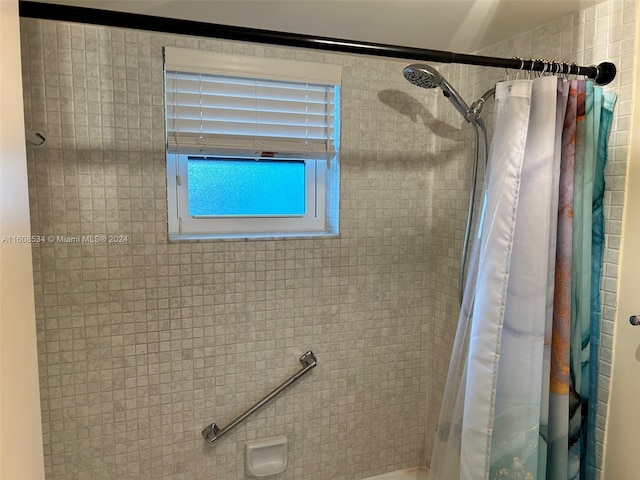 bathroom with curtained shower