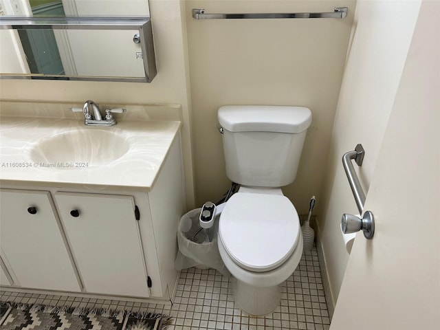 bathroom with tile patterned floors, vanity, and toilet