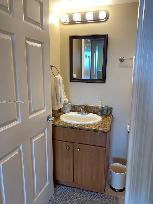 bathroom with vanity and tile patterned flooring