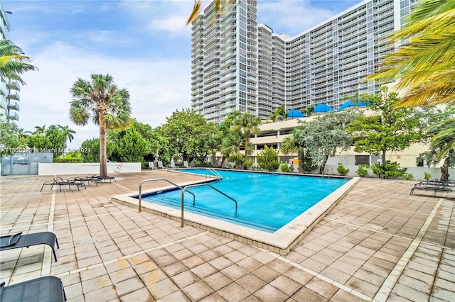 view of swimming pool featuring a patio area