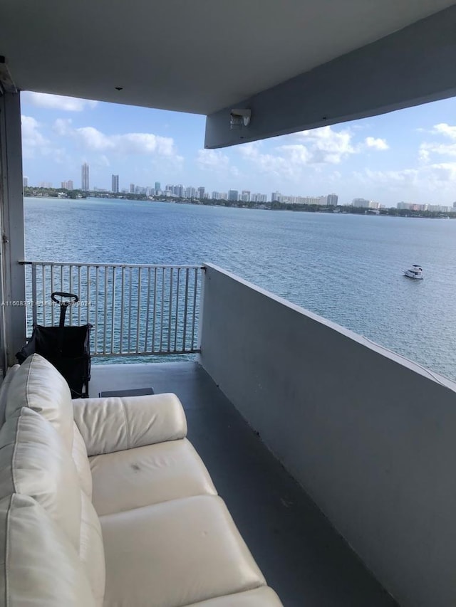 balcony featuring a water view