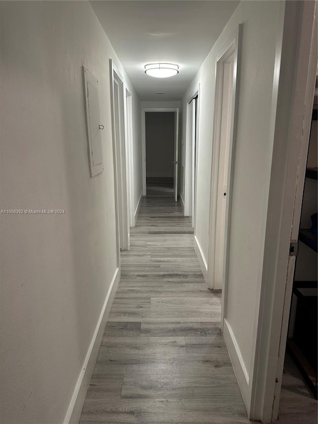 corridor featuring light hardwood / wood-style flooring