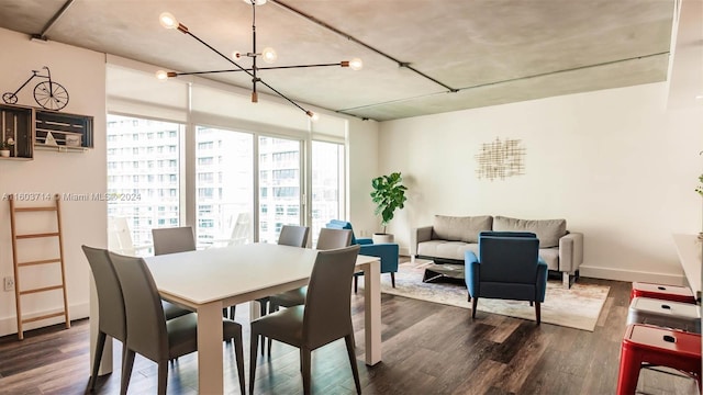 dining area featuring a chandelier and dark hardwood / wood-style floors