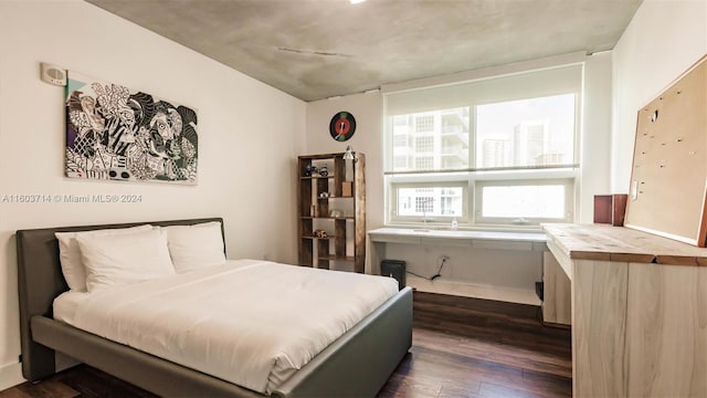 bedroom featuring dark hardwood / wood-style flooring