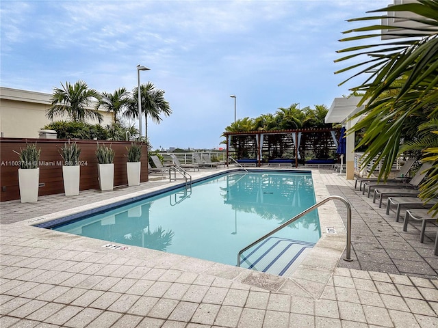 view of swimming pool featuring a patio