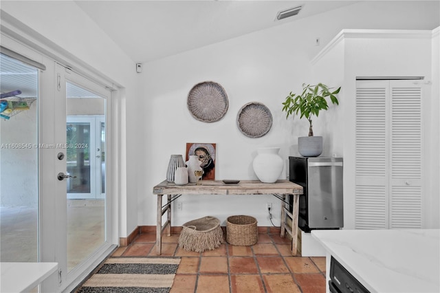 interior space featuring vaulted ceiling and french doors