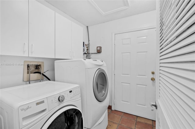 laundry room with hookup for a washing machine, tile flooring, washer and clothes dryer, and cabinets