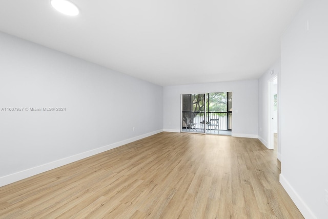 unfurnished room with light hardwood / wood-style floors