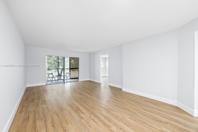 spare room featuring light wood-type flooring