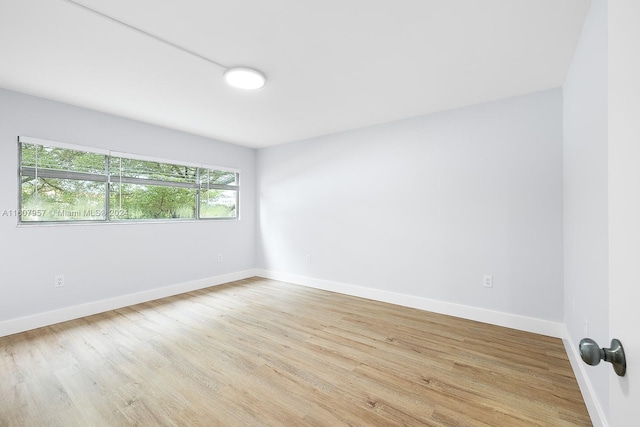 unfurnished room featuring light hardwood / wood-style flooring