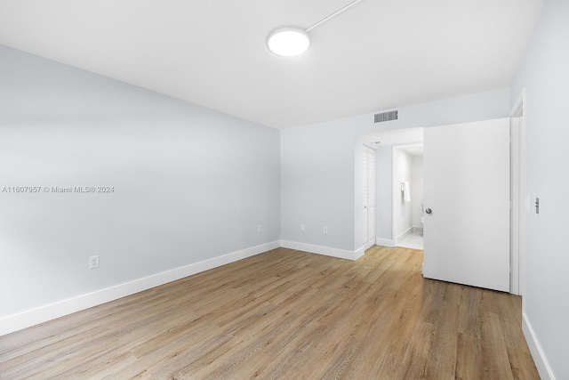 spare room with light hardwood / wood-style floors