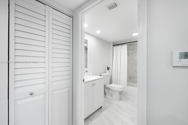 full bathroom featuring vanity, shower / tub combo, and toilet