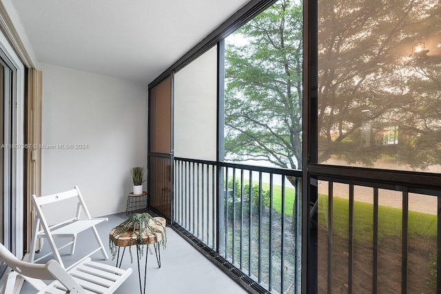 unfurnished sunroom featuring a wealth of natural light