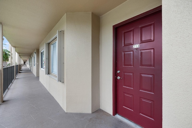 entrance to property featuring a porch