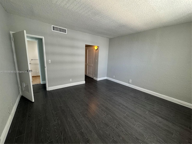 unfurnished bedroom with a textured ceiling and hardwood / wood-style floors