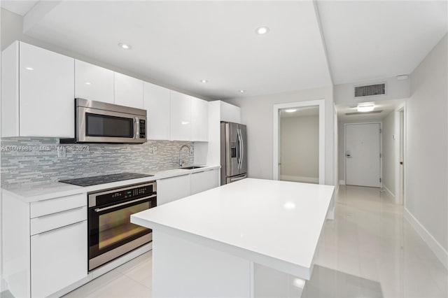 kitchen featuring white cabinets and a kitchen island