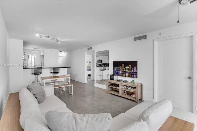 living room featuring concrete floors